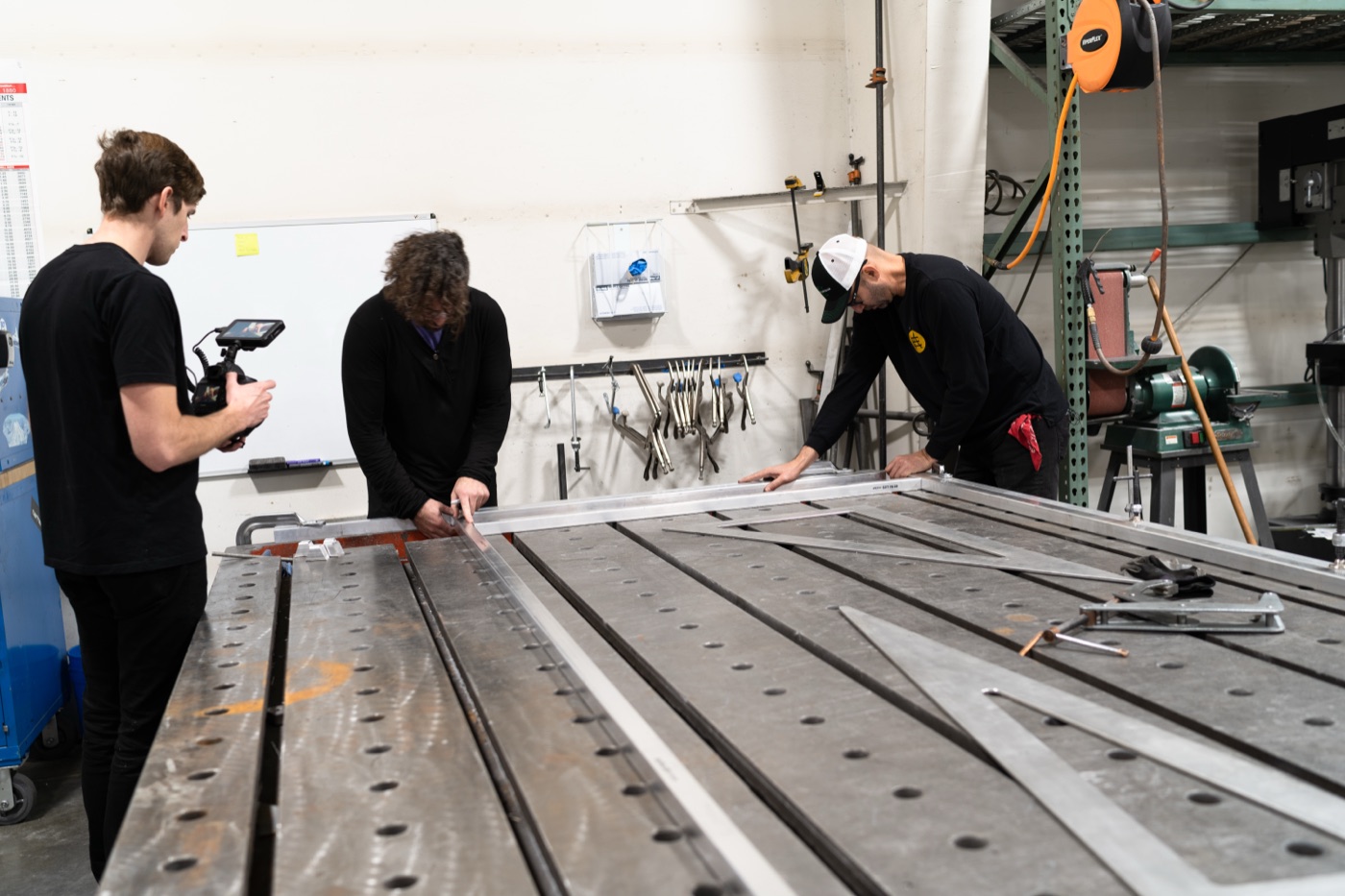Aluminum extrusion frame laid out on precision welding table