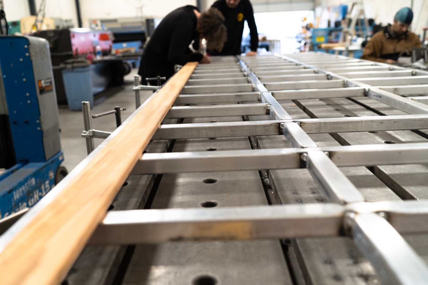 First hardwood slat laid into the completed aluminum frame